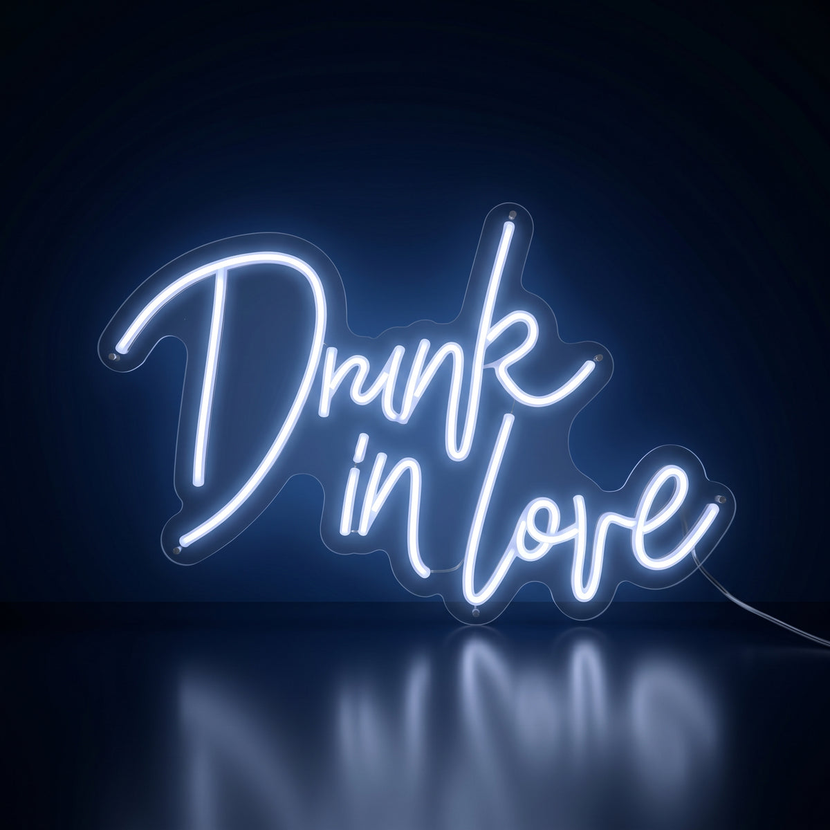 Drunk in Love white LED neon sign glowing in a dark room
