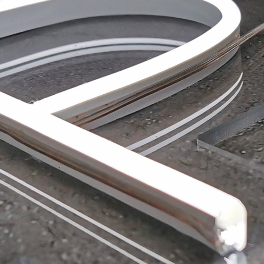 Close-up of a white neon LED tube on clear acrylic, showing smooth, even edges and clean lines